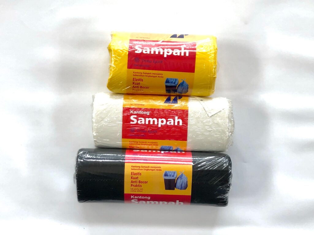Yellow, white and black trash bag rolls