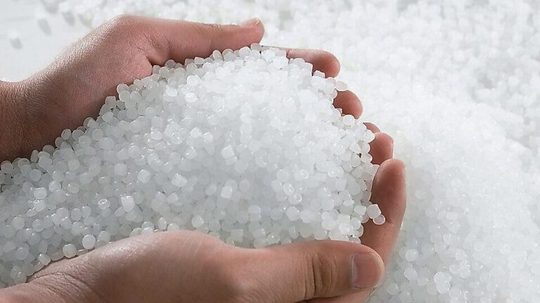Clear PE pellets in hands