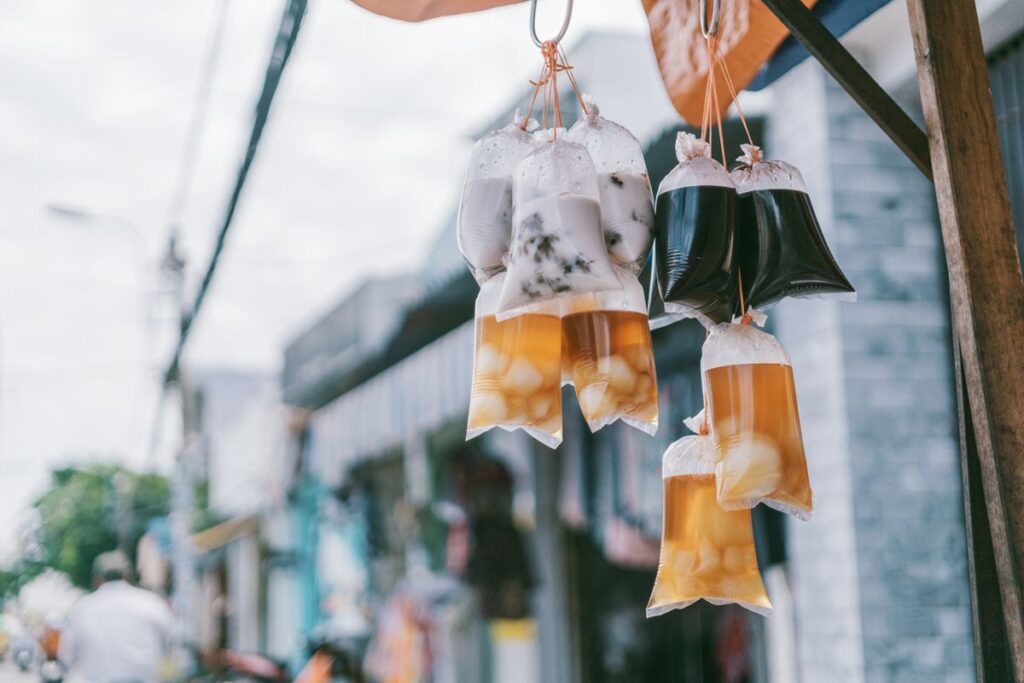 Drinks in plastic bags at a street vendor stall