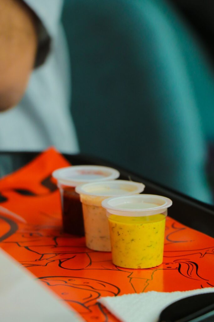 Sauces in clear plastic sauce cups