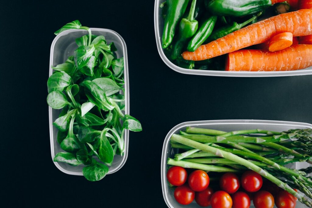 Fresh vegetables in clear plastic containers